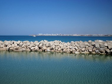 Concrete block dam. Water intake channel for the desalination of sea water. Kazakhstan. Mangistau region. Aktau. 15 May 2021 year.