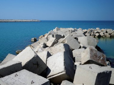 Concrete block dam. Water intake channel for the desalination of sea water. Kazakhstan. Mangistau region. Aktau. 15 May 2021 year.