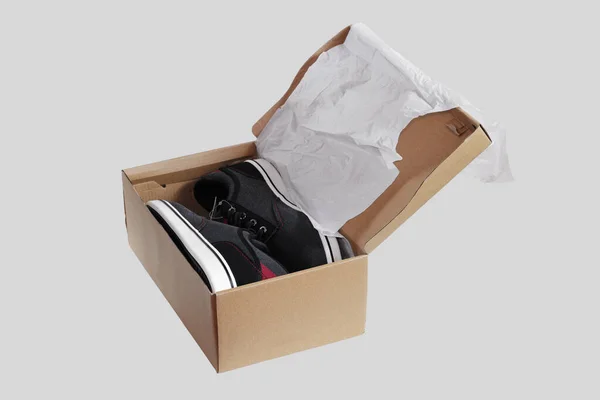 Gray Sneakers White Soles Cardboard Box Isolated Gray Background — Stock Photo, Image