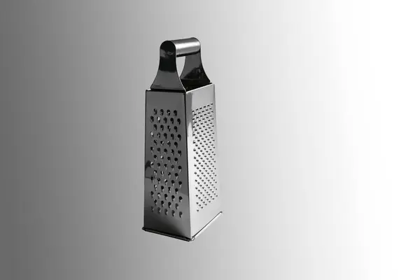 Stock image Manual vegetable grater. Close-up. Isolated on a gray background.