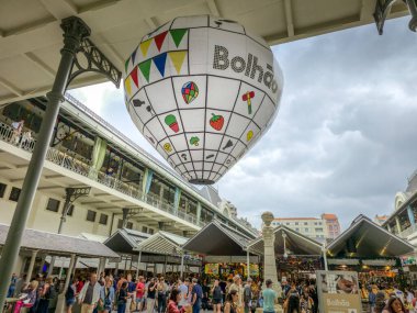 Porto, Portugal - 11 June, 2025: People walking in the Bolhao market decorated for the Festa de Sao Joao (Midsummer party). The traditional place is a neoclassic building famous for its fresh products.