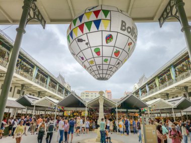 Porto, Portugal - 11 June, 2025: People walking in the Bolhao market decorated for the Festa de Sao Joao (Midsummer party). The traditional place is a neoclassic building famous for its fresh products.