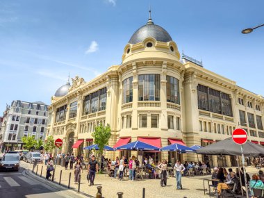 Porto, Portugal - 11 June, 2025: People walking in front of the Bolhao market. The traditional place is a neoclassic building famous for its fresh products.