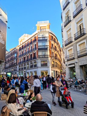 Madrid, Spain - 04 February, 2023: People walking in the Calle de Preciados street. The public street spans from Puerta del Sol to Plaza de Santo Domingo via Plaza de Callao.