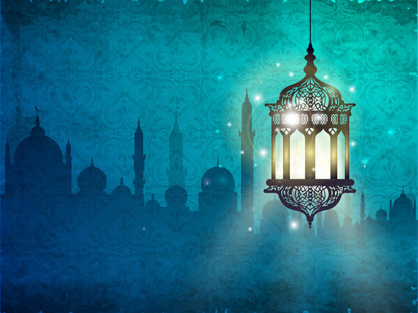 Illuminated Lantern Hang on Silhouette Mosque Blue Background and Space for Message as a Islamic Festival Ramadan Mubarak.