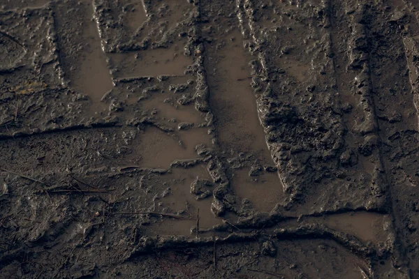 深色泥泞道路背景 轮胎痕迹 肮脏地面 — 图库照片