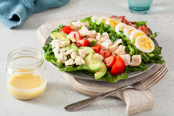 stock image healthy American Cobb salad with egg bacon avocado chicken tomato. hearty keto low carb diet