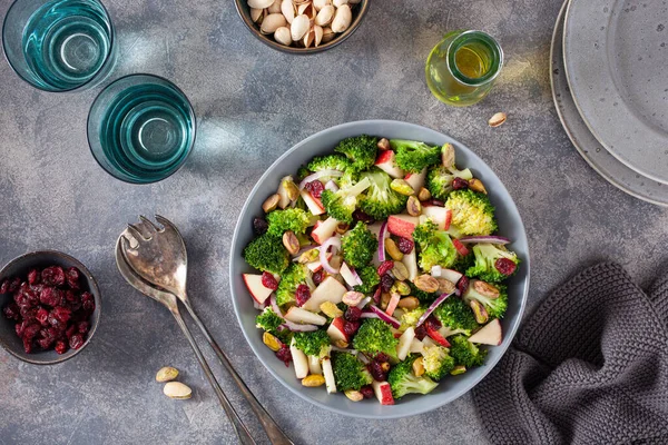 stock image healthy broccoli salad with apple onion dried cranberries pistachio. vegan low carb diet
