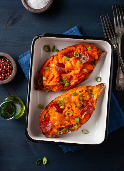 stock image twice baked sweet potato with cheese and chorizo sausage