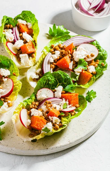 stock image healthy sweet potato lettuce boats with radish, feta cheese, lentils