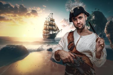 Portraiit of handsome buccaneer dressed in cocked hat and white shirt on shore.