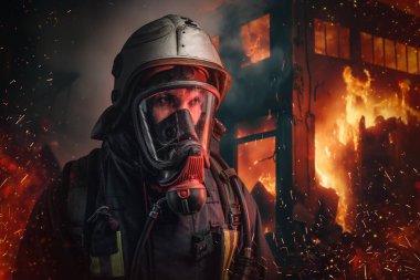 Portrait of fireman hero dressed in fire protective uniform rescuing people.