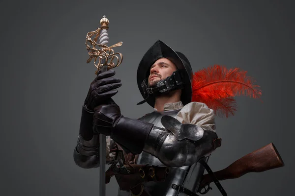 Shot Handsome Musketeer Man Dressed Plate Armor Holding Sword Looking — Stockfoto