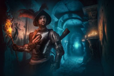 Portrait of ancient conquistador holding burning torch in dark dungeon.