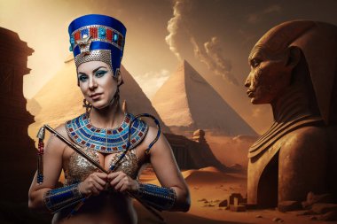 Portrait of glamor pharaoh woman holding whip and hook in cross.