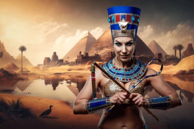 Portrait of glamor pharaoh woman holding whip and hook in cross.