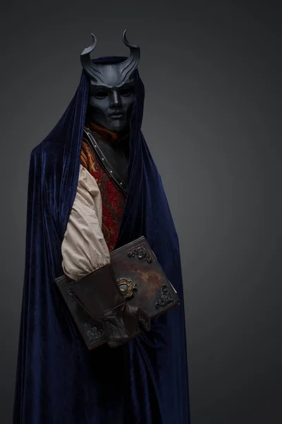 Shot Dark Cultist Dressed Horned Mask Robe Holding Book — Stock Photo, Image