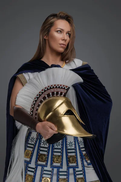 Studio Shot Greek Warlord Woman Dressed Armor Holding Golden Helmet — Stock Photo, Image