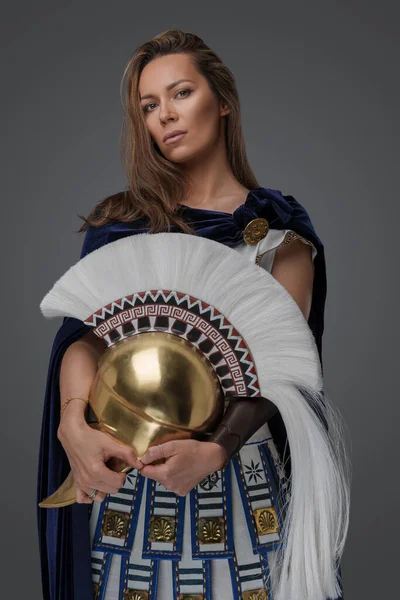 Studio Shot Greek Warlord Woman Dressed Armor Holding Golden Helmet — Stock Photo, Image