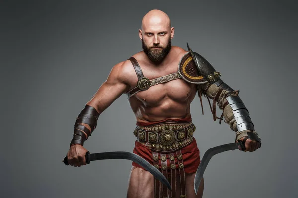 Bald Bearded Gladiator Poses Standing Tall Two Swords While Wearing — Stock Photo, Image