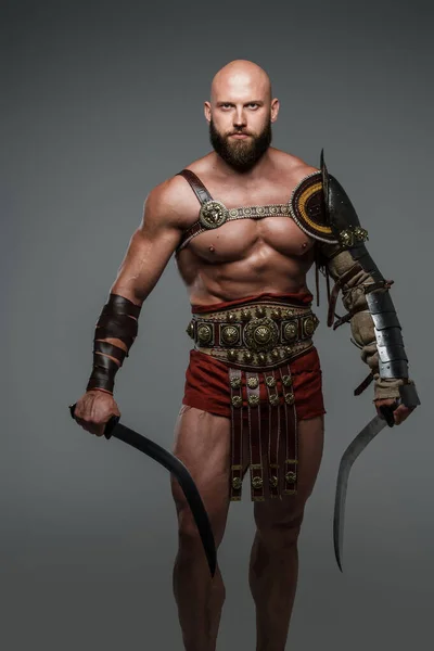 Bald Bearded Gladiator Poses Standing Tall Two Swords While Wearing — Stock Photo, Image