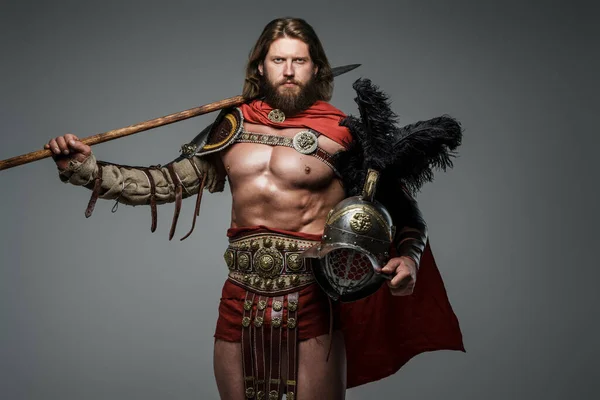 Bearded Gladiator Long Hair Stands Gray Background Light Armor Red — Stock Photo, Image