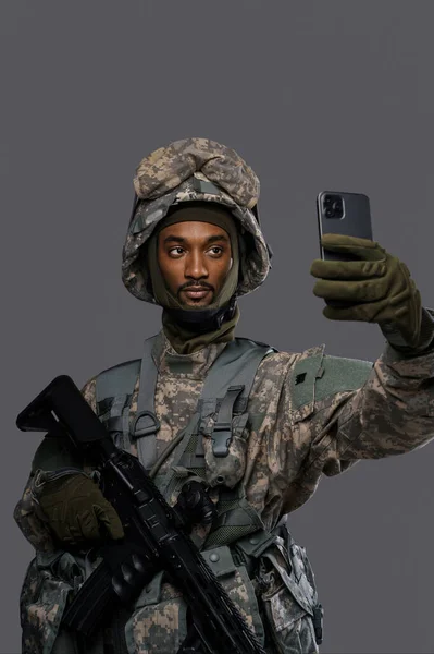 Young Military Man Uniform Helmet Captures Selfie Video Call Smartphone — Stock fotografie