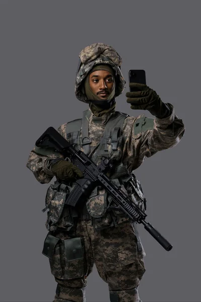 Young Military Man Uniform Helmet Captures Selfie Video Call Smartphone — Stok Foto