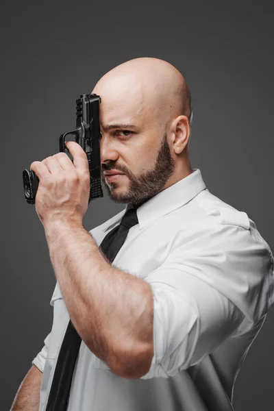 Dramatic Portrait Bald Bearded Man White Shirt Tie Pressing Pistol — Stock Photo, Image