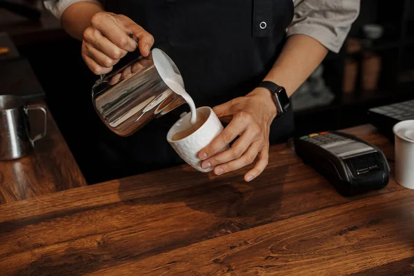 Close Baristas Hands Pouring Frothed Milk Paper Coffee Cup Blurred — Stock Photo, Image