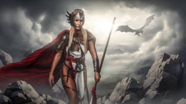 Kanatlı miğferli destansı Valkyrie ve elinde mızrak olan kırmızı pelerinli, arka planda uçan bir ejderha.