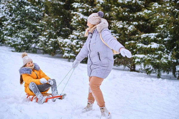 stock image Happy family having fun outdoor. Mother and child playing in winter time. Active healthy lifestyle concept