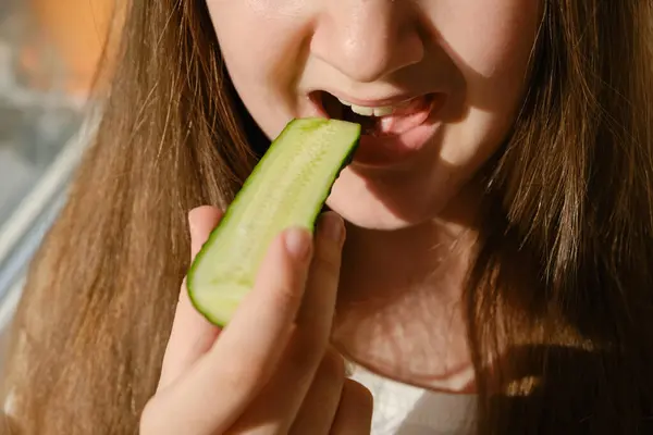 Kid Bites Cucumber Close Unrecognizable Face Girl Eating Cucumber Home Royalty Free Stock Images