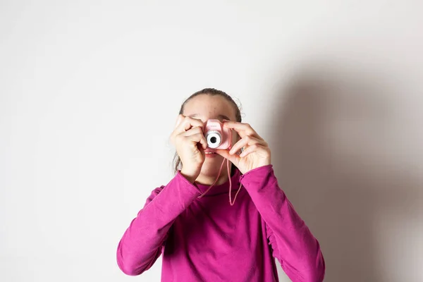 stock image Little Girl Taking Picture Using Toy Photo Camera on white background