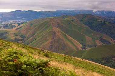 French Pyrenees green valley along the way of Saint James. Scenic view of landscape and mountains against sky