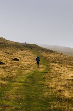 Pilgrim from behind along the Camino de Santiago. Path of the way of St James in the French Pyrenees