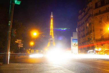 Paris, France - July, 13: Eiffel Tower brightly illuminated at dusk in Paris. It's the most visited monument of France on 13 July, 2022