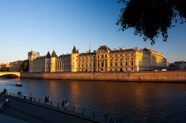 View of the River Seine and the Conciergerie at sunset in Paris, France