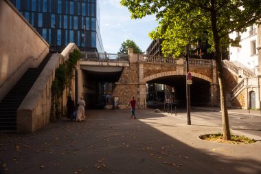 Paris, France - July, 13: People walking in Rue du Chevaleret. Quartier de la Gare, 13th arrondissement on 13 July, 2022