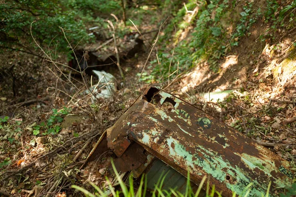 stock image Old abandoned car wreck polluting the environment, Slovenia