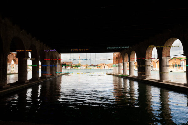 Venice, Italy - April 18, 2024: Installation by Claire Fontaine titled Foreigners Everywhere/Stranieri Ovunque at the Gaggiandre of the Arsenale for the 60th International Art exhibition of Venice biennale
