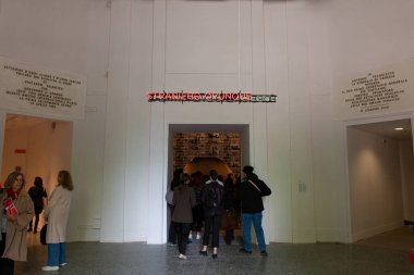 Venice, Italy - April 18, 2024: Installation by Claire Fontaine titled Foreigners Everywhere/Stranieri Ovunque at the Entrance of the Central Pavilion for the 60th International Art exhibition of Venice biennale clipart