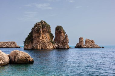 View of the famous Faraglioni , stacks of Scopello, immediately in front of the buildings of the former old tuna fishery called Tonnara