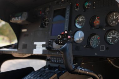 Joystick to control the helicopter. Flight deck with flight control elements and multifunctional displays in a I-ULYA helicopter clipart