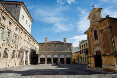 Piazza Matilde di Canossa in Mantua, featuring the historic church and palace, with a charming view of the square's architecture clipart