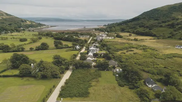 Slow Motion Scottish Whisky Distillery Village Aerial Road Cottages Houses — Stock Photo, Image