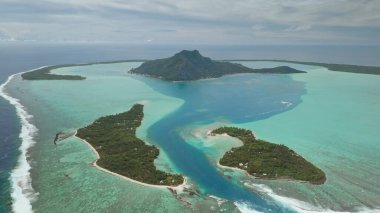 Breathtaking aerial view of Maupiti island, French Polynesia, showcasing lush greenery, turquoise lagoon, coral reef and vast expanse pacific ocean. Remote wild nature paradise, exotic summer travel clipart