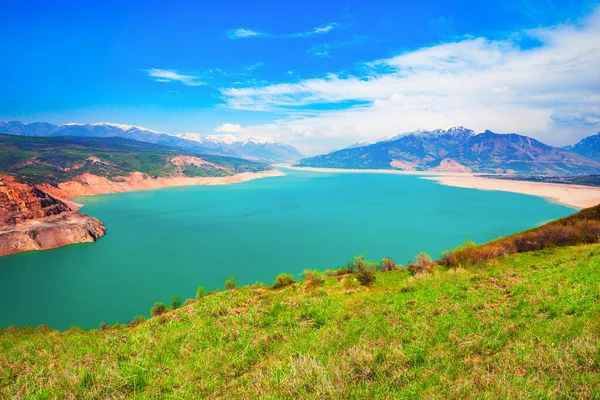 Lake Charvak or Chorvoq is a water reservoir in Chimgan region, Tian Shan or Tengri Tagh mountain range near Taskent city in Uzbekistan