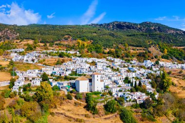 Bubion village aerial panoramic view. Bubion is a village in the Alpujarras area in the province of Granada in Andalusia, Spain. clipart