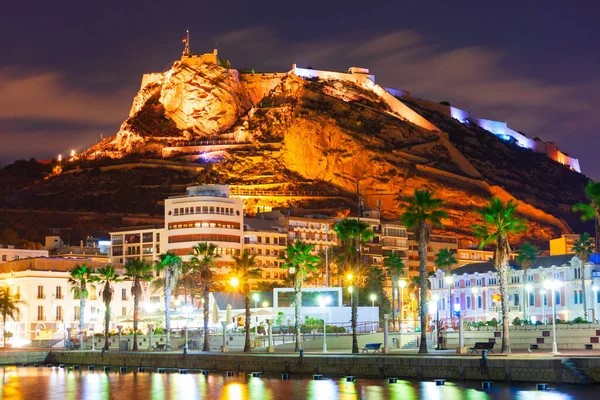 stock image Port square and Santa Barbara Castle on background. Santa Barbara Castle is a fort stands on Mount Benacantil in the center of Alicante, Spain.